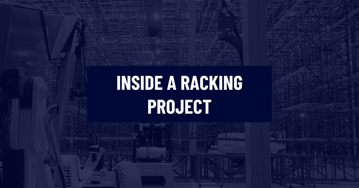 Industrial warehouse installation site with complex steel pallet racking infrastructure, forklifts, and material handling equipment under construction, with a text overlay reading Inside a Racking Project.
