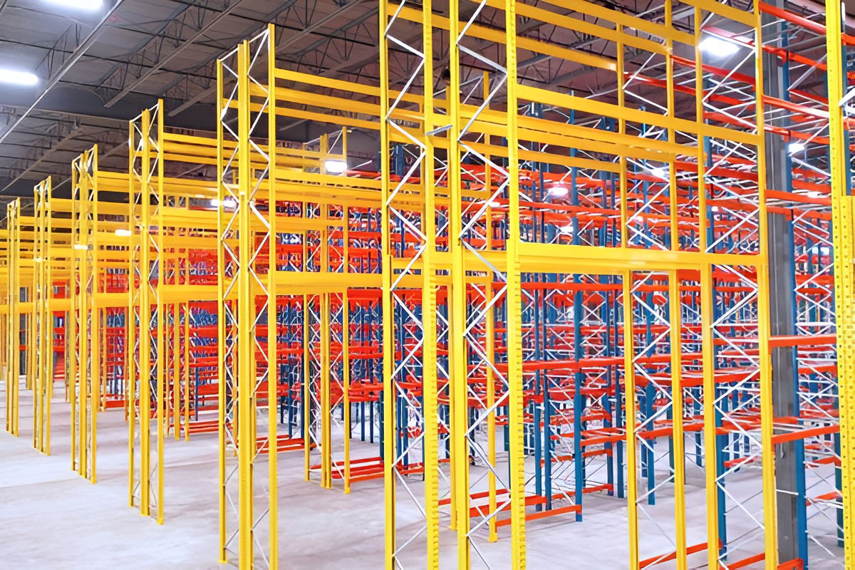 Perspective view of heavy-duty yellow selective rack uprights and load beams configured for high-capacity warehouse storage.